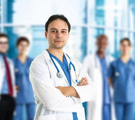 Doctor in front of his team