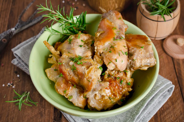 Oven Baked rabbit legs with potatoes and rosemary