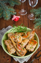 Oven Baked rabbit legs with potatoes and rosemary