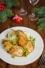 Oven Baked rabbit legs with potatoes and rosemary