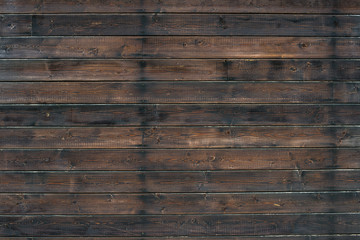 Fototapeta premium Old brown wooden wall, detailed background photo texture. Wood plank fence close up.