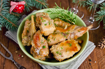 Oven Baked rabbit legs with potatoes and rosemary