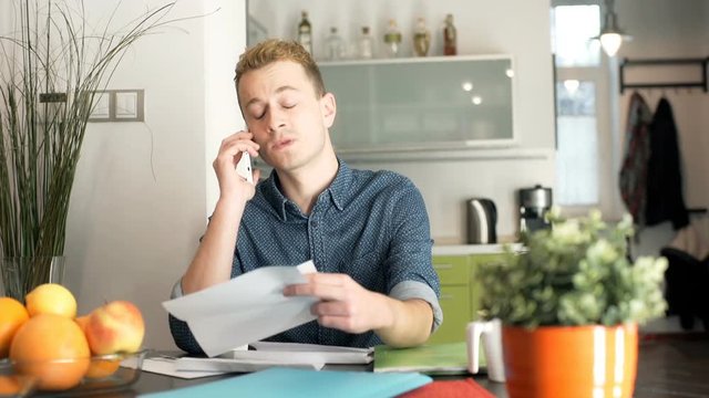 Angry man calling about his checks and arguing with someone
