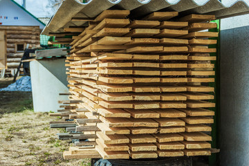 Storage edged boards stacked in the country.