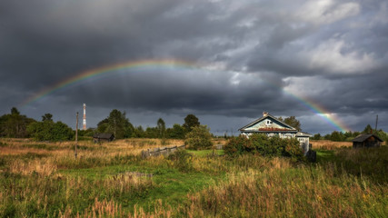 Rainbow in the village. Russia.