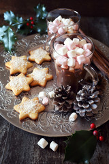 Christmas cookies and cups of hot chocolate  with marshmallow