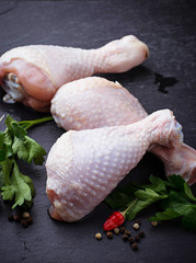 Raw chicken legs with parsley