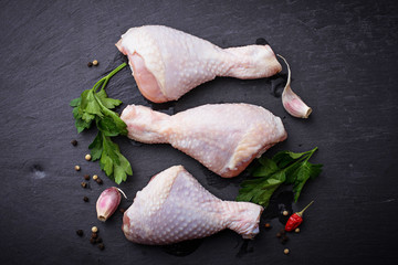 Raw chicken legs with parsley