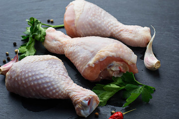 Raw chicken legs with parsley