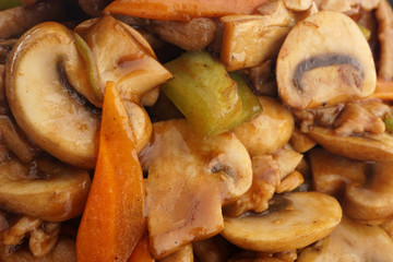 Chinese food. Pork with mushrooms and vegetables