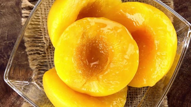 Rotating preserved Peaches (seamless loopable as 4K UHDfootage)