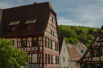 Fototapeta na wymiar MOENSHEIM, PFORZHEIM, GERMANY - JUNE 10, 2015: Tudor style house. Monsheim is a town in the district of Enz in Baden-Wuerttemberg in southern BRD.