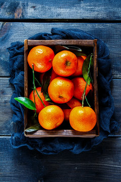 Box of juicy tangerines