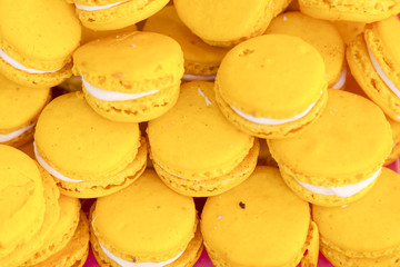 Close up ofl macarons dessert with yellow pastel tones