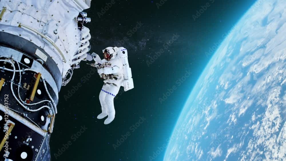 Wall mural astronaut in outer space against the planet earth.