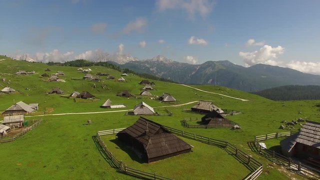 Aerial View Of Mountain Village With Mountain Alps Background At Summer