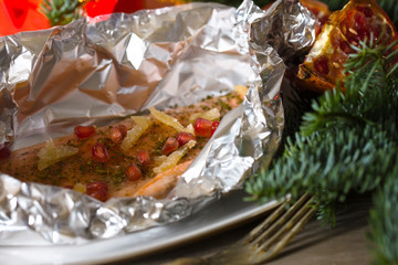 Christmas  recipe: salmon trout with ginger and pomegraate berri