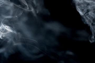 White smoke on a black background.