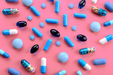 Color pills on pink background