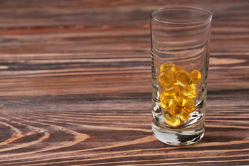 Fish oil capsules in glass