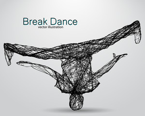 Silhouette of a break dancer.