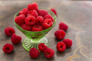 Red Raspberries in a green depression glass