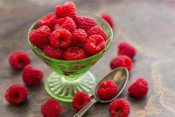 Red Raspberries in a green depression glass