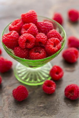 Red Raspberries in a green depression glass