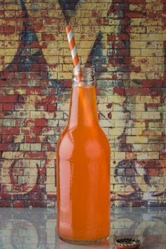 Orange Soda Bottle With A Straw