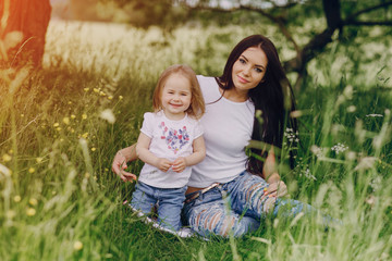 Fototapeta premium child near tree with mom