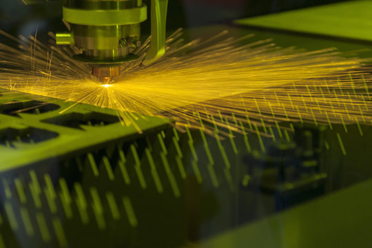 The laser cutter machine while cutting the sheet metal 