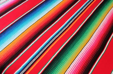 Gordijnen background Mexican blanket Poncho serape Mexican Mexico cinco de mayo blanket fiesta with stripes diagonal copy space blanket pattern backdrop stock photo photograph picture image  © cheekylorns