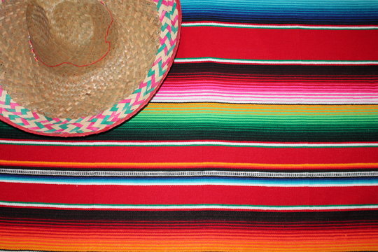 Mexican poncho sombrero Mexican cinco de mayo background Mexico blanket rug fiesta with stripes stock, photo, photograph, image, picture