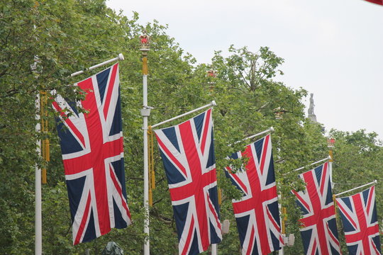 Many defocussed Union Jack flags background copy space