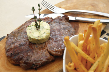 Close up of steak and French fries. Selective focus.
