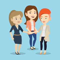 Obraz premium Group of business women joining hands.