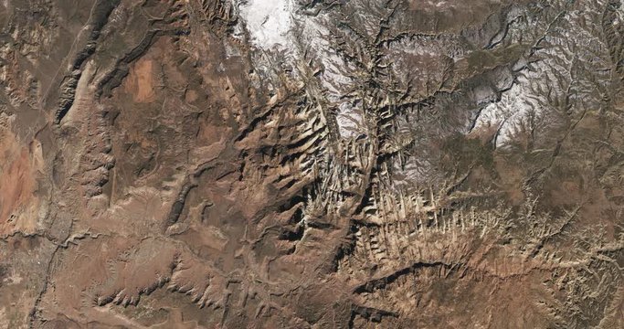 High-altitude overflight aerial of Zion National Park, Utah, summer. Clip loops and is reversible. Elements of this image furnished by USGS/NASA Landsat 