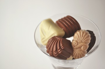 Chocolates in a champagne glass with copy space