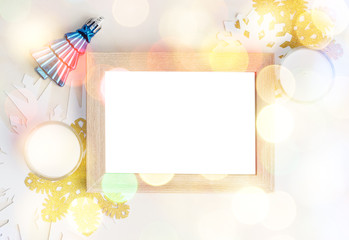 Empty photo frame with christmas tree toy, white and gold snowfl