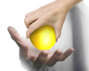 Hand giving one golden egg