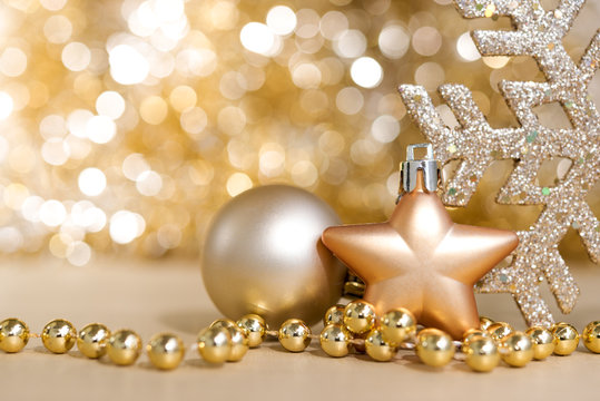 Christmas ornaments with gold circle bokeh light sparkle backgro