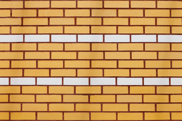 Obraz premium ściana z żółtej i białej cegły ceramicznej