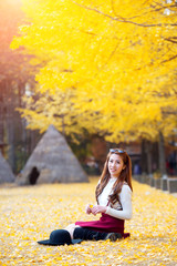 Beautiful Girl with Yellow Leaves in Nami Island, Korea. Nami is