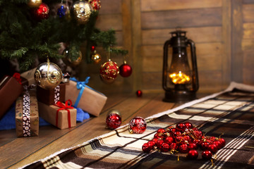 christmas gift and objects under fir tree