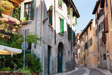Fototapeta na wymiar old houses on street in Verona city