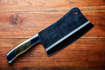 Kitchen knife on wooden table background