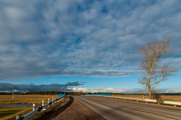 country asphalt automobile road under the original cloudy sky