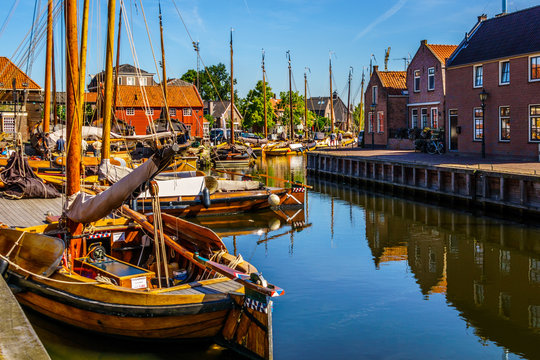 Fototapeta Traditional Dutch Botter Fishing Boats in the Harbor of the historic village of Spakenburg-Bunschoten. The village was once a major fishing center on the now dammed IJselmeer