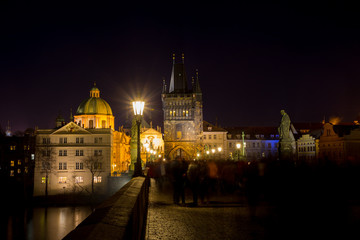 Fototapeta na wymiar Night photo of Prague Charles Bridge and powder tower