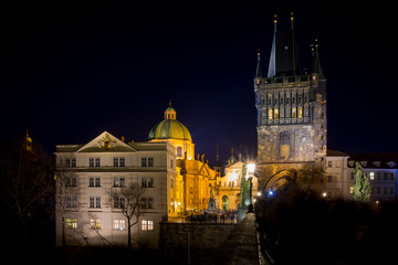 Fototapeta na wymiar Night photo of Prague Charles Bridge and powder tower